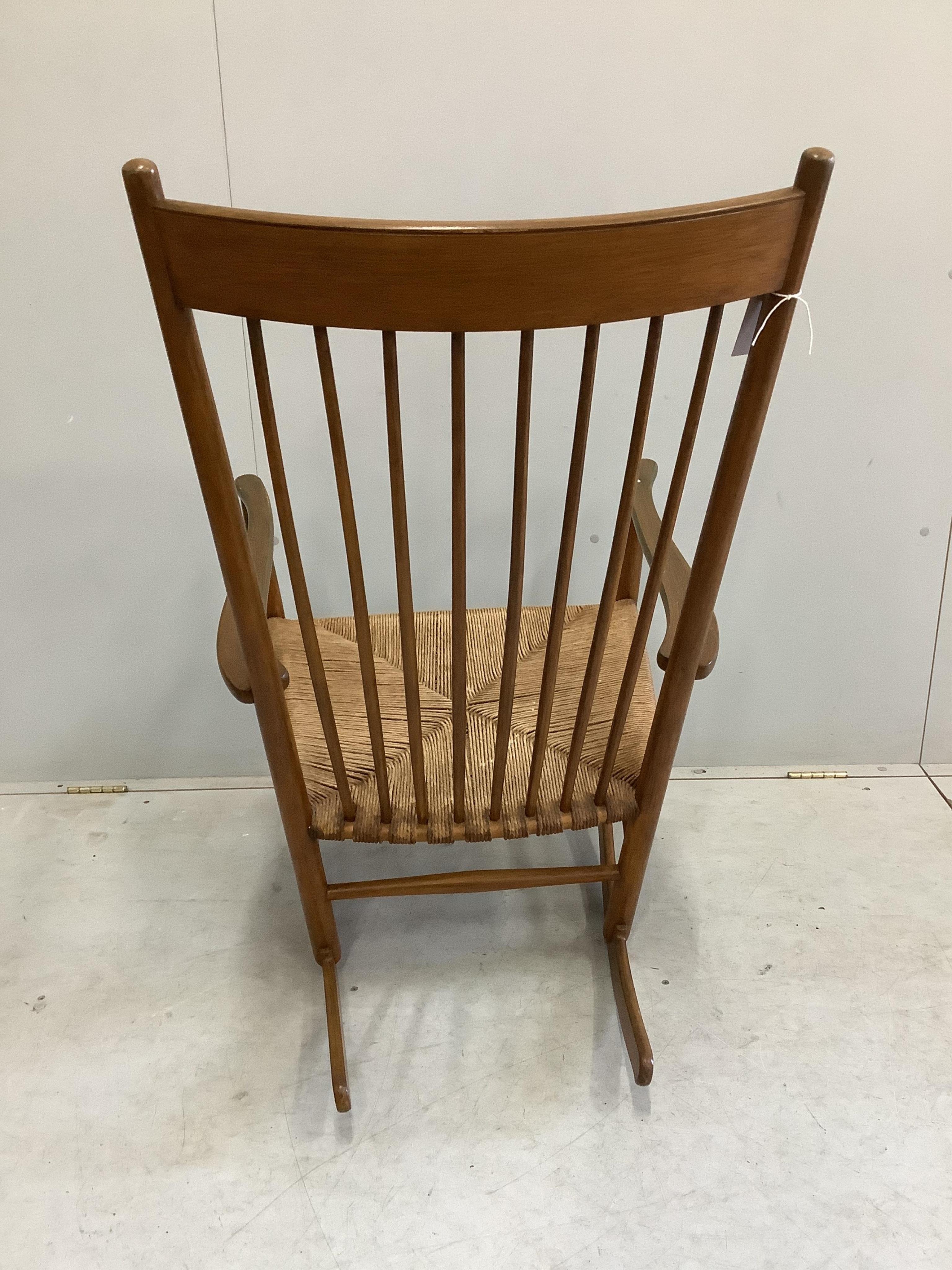 A Hans Wegner style rocking chair, width 63cm, height 106cm. Condition - fair